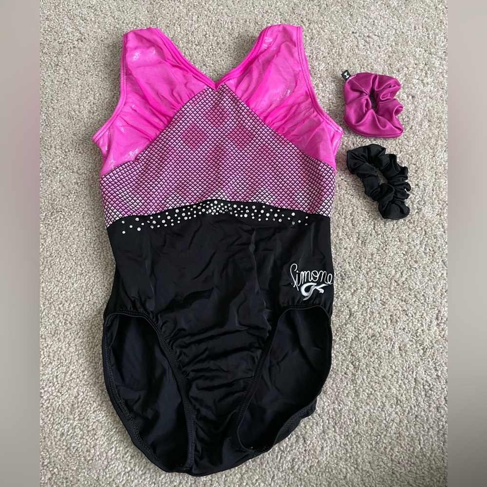 Gently used Simone Biles GK leotard in size adult medium, pink/black scrunchie